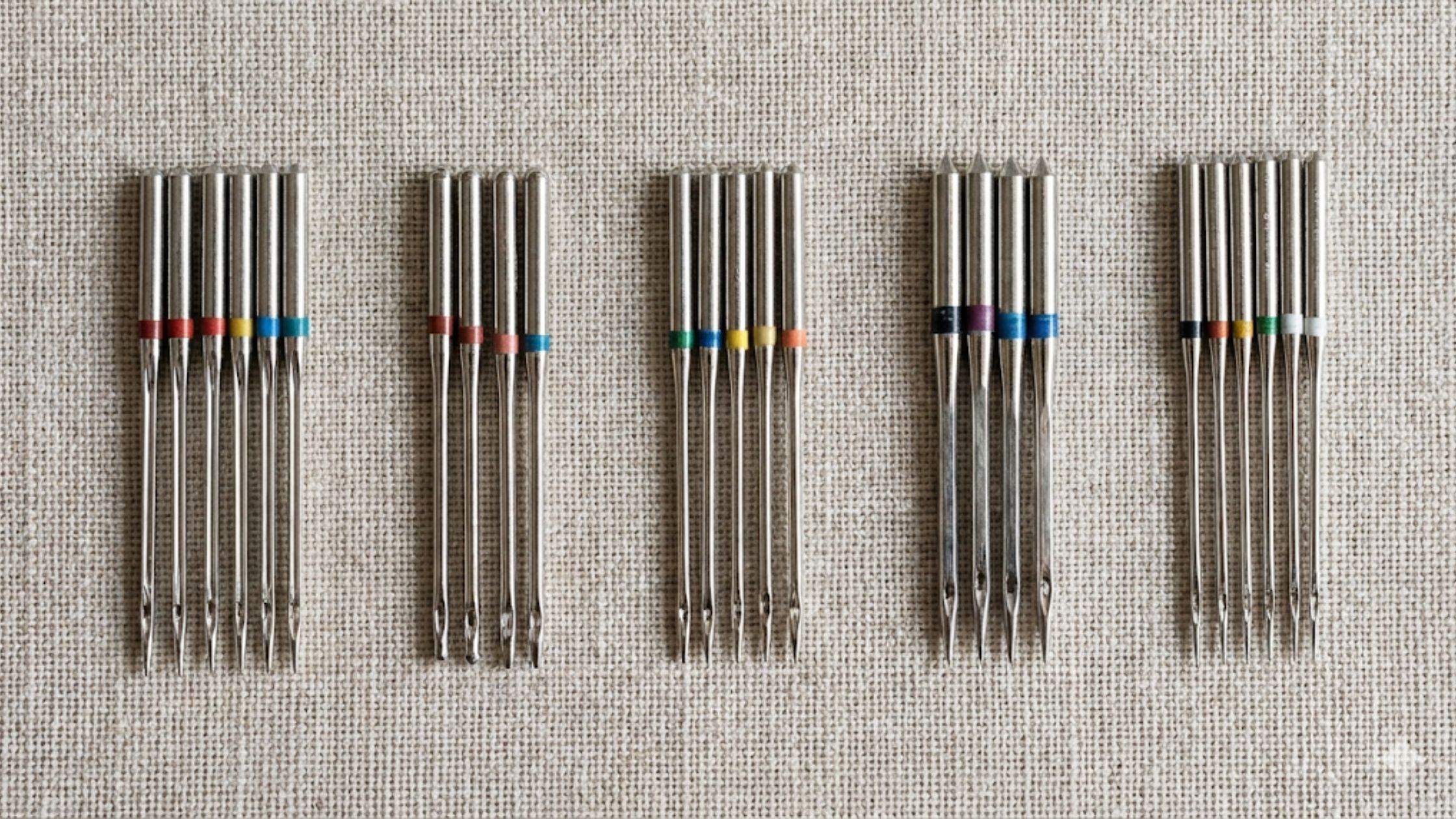 Tipos de agulha para máquina de costura utilizados em tecidos variados